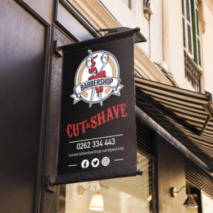 Enseigne extérieur avec le logo d'un barbier